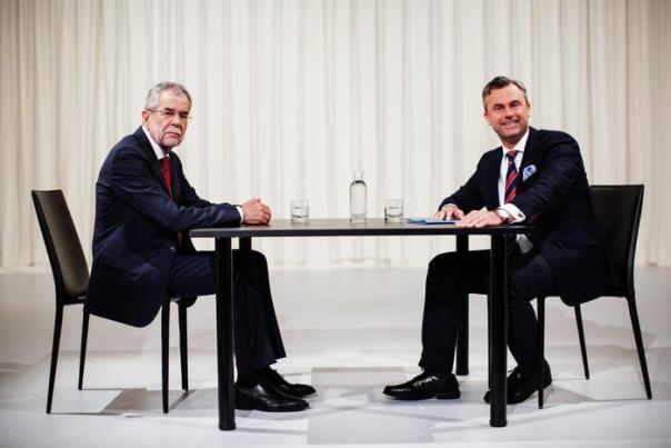 Austrian right wing Freedom Party (FPOe) top candidate Norbert Hofer (R) and top candidate Alexander Van der Bellen, supported by The Greens, react ahead of a television debate in Vienna, Austria, 15 May, 2016. The presidential run-off vote will take place on 22 May 2016.  ANSA /LISI NIESNER