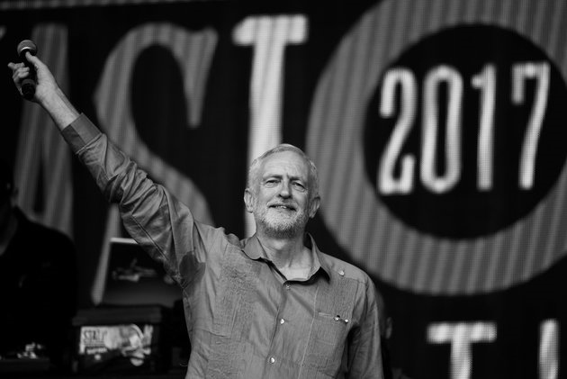 Britain's opposition Labour Party leader Jeremy Corbyn acknowledges the crowd at Worthy Farm in Somerset during the Glastonbury Festival